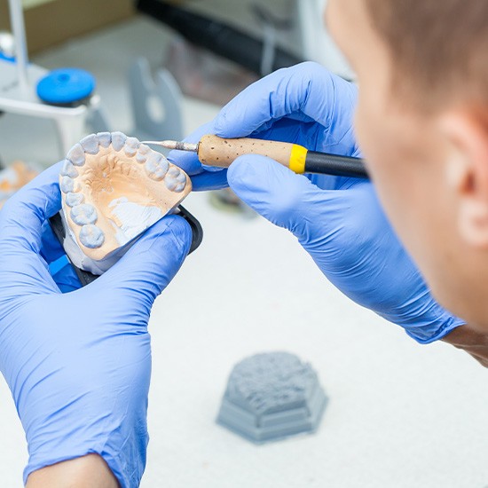 Lab tech carving denture