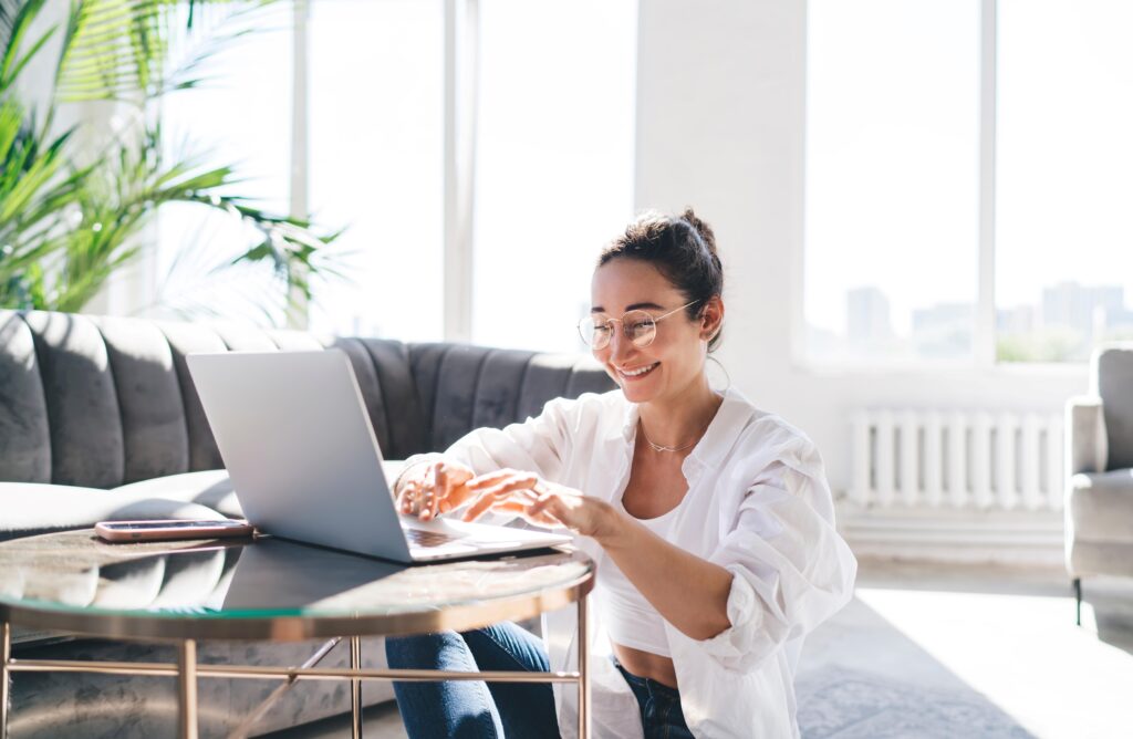 Woman smiling while working at home